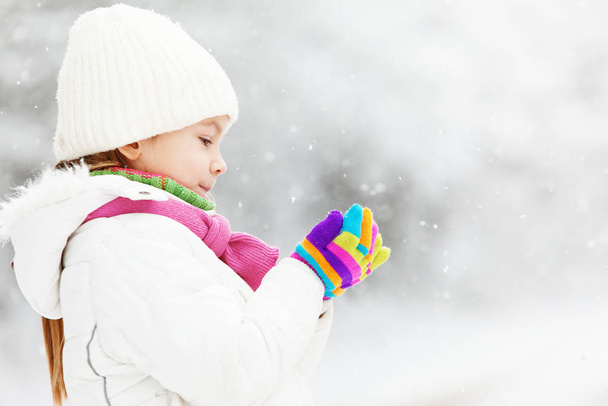 Portrait of cute little girl in winter - Фото, изображение