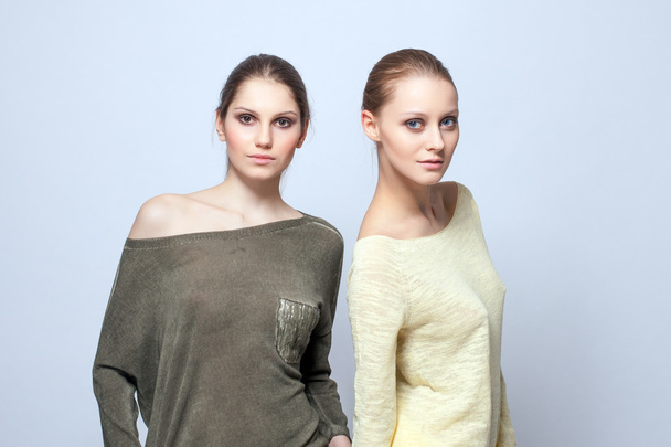 Two charming models posing in casual clothes - Fotó, kép