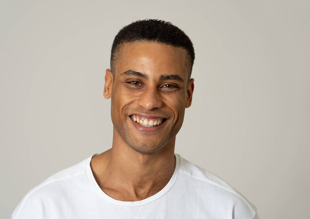 Portrait of happy african american man having fun and joy smiling at the camera and looking to something that makes him lough. In Human emotions facial expressions, happiness and beauty concept. - Foto, afbeelding