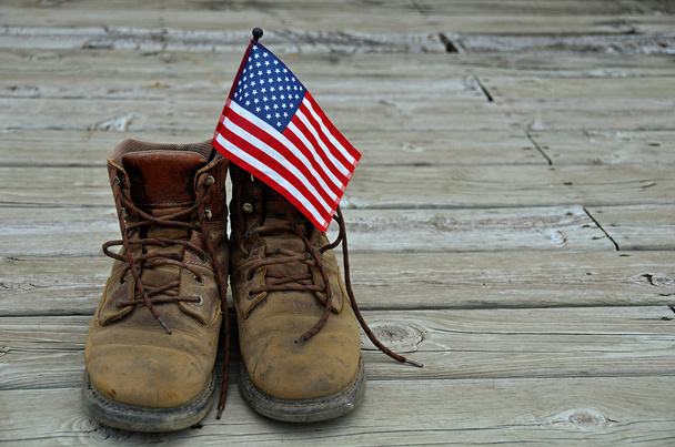 Flag in work boots - 写真・画像