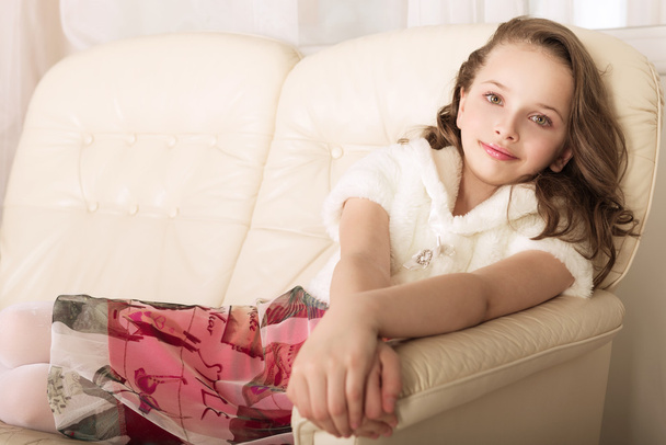 fashion little girl on sofa - Фото, зображення