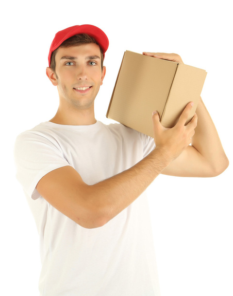 Young delivery man holding parcel, isolated on white - Fotografie, Obrázek