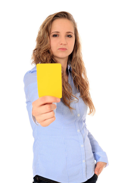Portrait of an attractive young girl showing yellow card. All on white background. - Fotó, kép