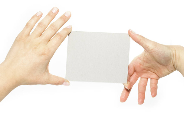 a kezében reklámkártya fehér alapon - Fotó, kép