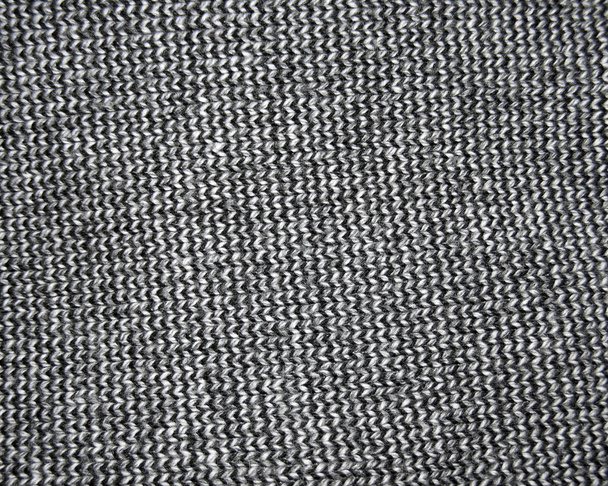 Background made of a knitted dark clothing. - Photo, Image