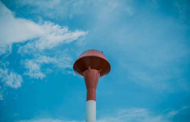Red and white steel water tank, sky background - Foto, Imagen