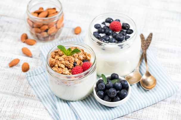 Jar of yogurt with granola and berries - Foto, imagen