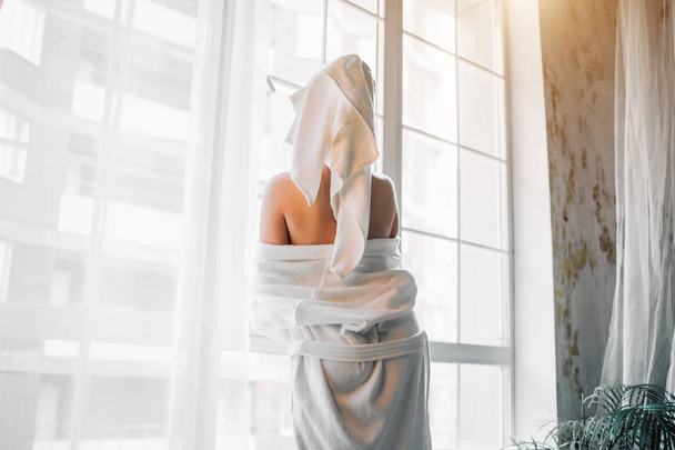 Slim sexy woman in bathrobe and towel on head - Foto, Imagen