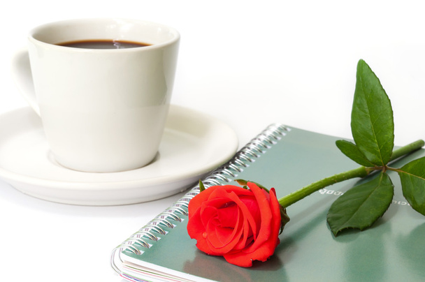 Red rose on the notebook. - Foto, Imagem