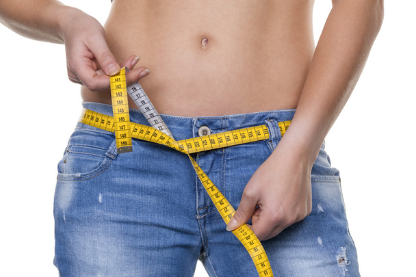 Woman with measuring tape before the next diet - Foto, imagen