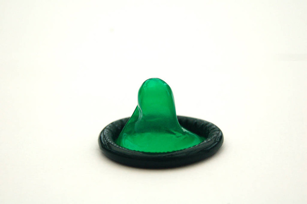 Bright Green Condom on White Background - Fotografie, Obrázek