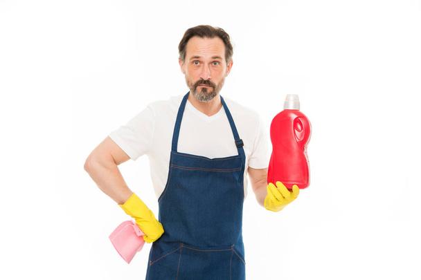 Helping about the house. Senior man holding bottle of laundry detergent or dish soap. Mature man doing household service. Household laundering. Household worker. Providing household service - Foto, Imagem