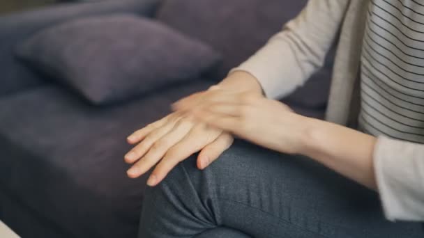 Close-up of anxious young womans hands moving during session with therapist - Video, Çekim