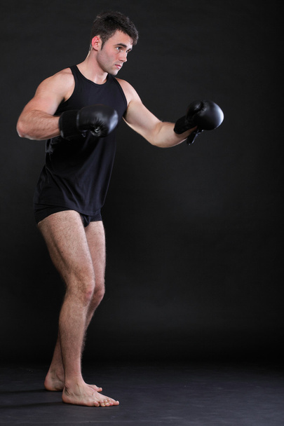 Portrait sportsman boxer in studio dark background - Foto, Imagem