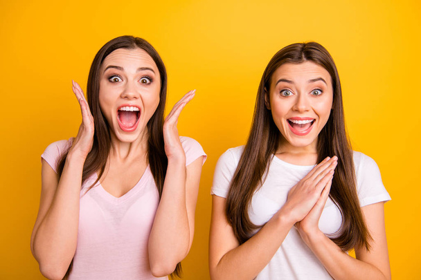 Close up photo two people beautiful funny funky she her models ladies pretty appearance yelling loud favorite football team goal lucky wear white pink casual t-shirts isolated yellow background - Foto, imagen
