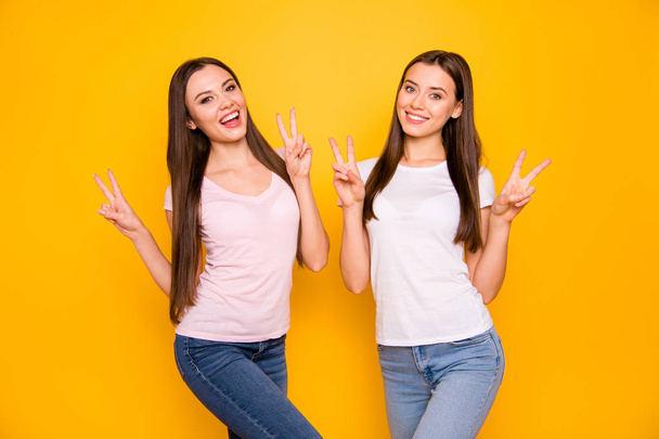 Portrait of cute pretty charming lovely youngsters students people long hair have free time feel glad rejoice laugh make v-signs isolated colorful background  dressed pastel cotton denim clothing - Fotó, kép