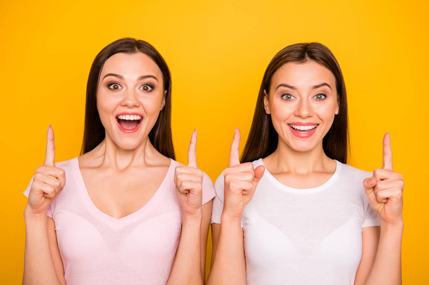 Close-up portrait of nice-looking cute charming sweet winsome lovely attractive cheerful optimistic positive straight-haired ladies pointing up isolated over bright vivid shine background - Fotoğraf, Görsel