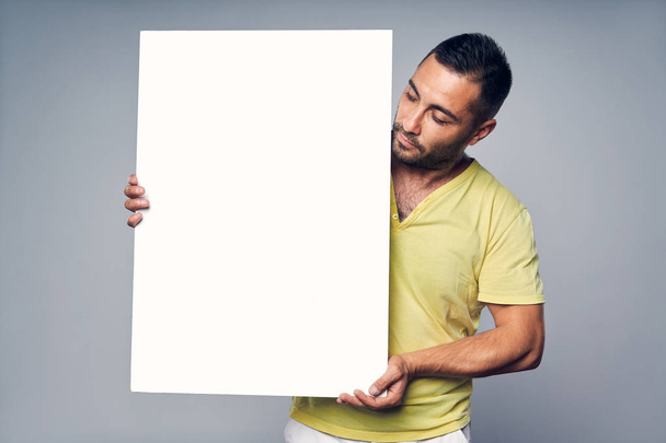 Man holding blank white board with copy space for text - Fotoğraf, Görsel