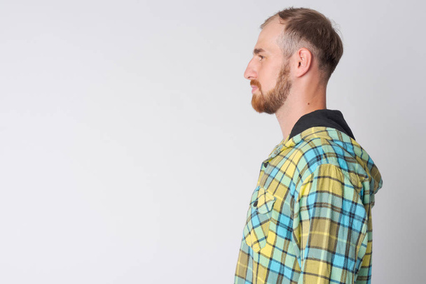 Profile view of young bearded hipster man - Fotografie, Obrázek