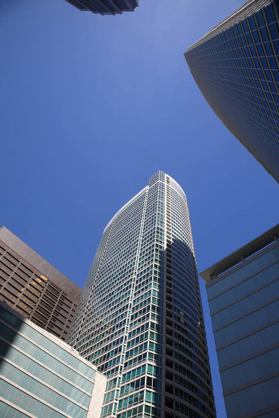 Chicago buildings rise into a blue sky - Foto, Bild