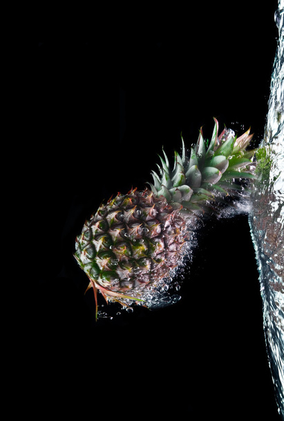 View of two nice fresh pineapples on black background - Photo, Image