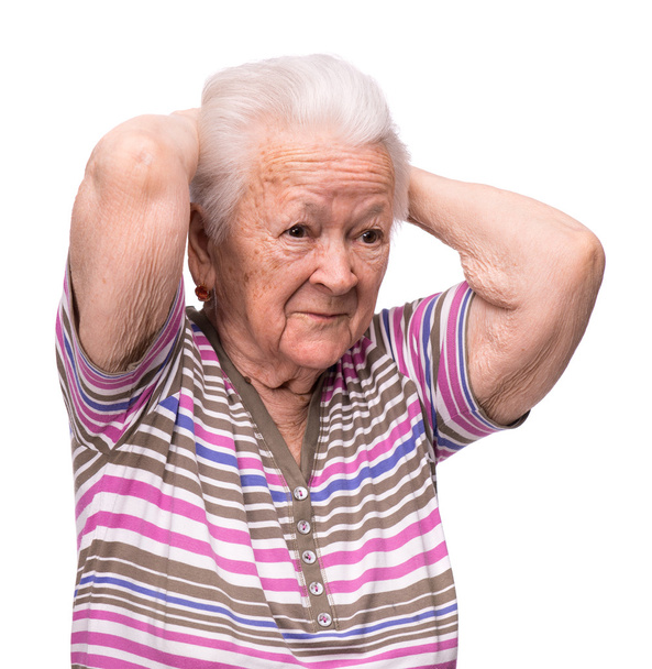 Anciana que sufre de dolor de cabeza
 - Foto, Imagen