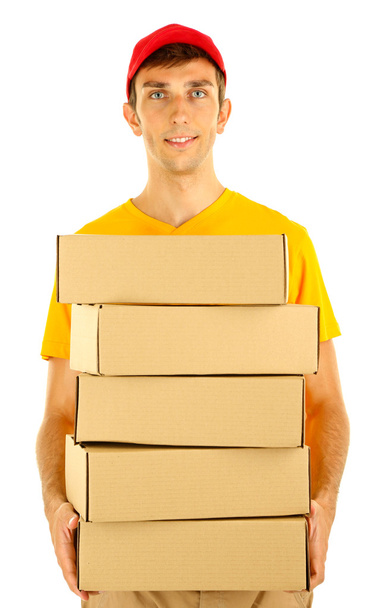 Young delivery man holding parcels, isolated on white - Фото, зображення