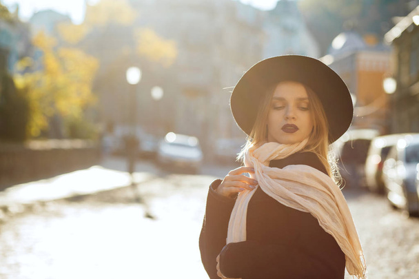 Closeup portrait of beautiful blonde woman wearing hat and scarf - Valokuva, kuva