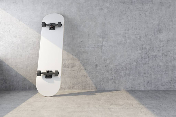 white skateboard on concrete wall background - Фото, изображение