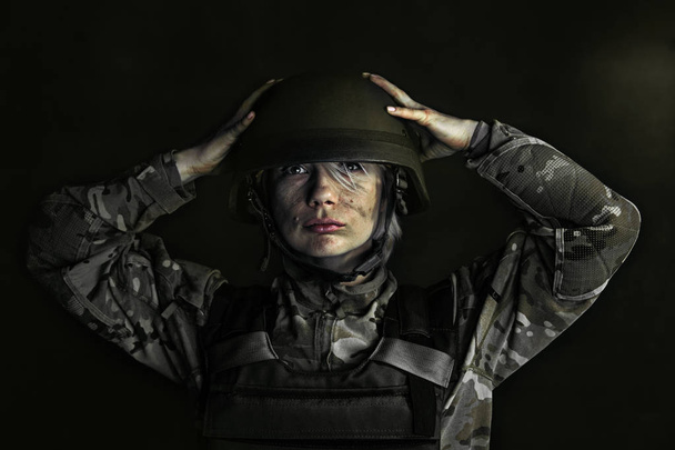 Portrait of young female soldier - 写真・画像