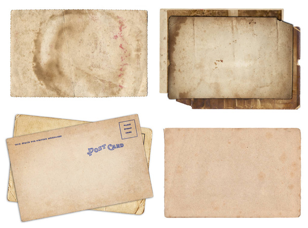 Joukko erilaisia vanhoja papereita ja postikortteja naarmuilla ja tahroilla
 - Valokuva, kuva