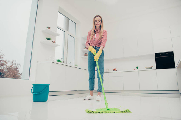 Full length body size photo beautiful busy nice duties she her lady wash white floor carefully look down not hurry housemaid wear jeans denim casual plaid checkered shirt bright light kitchen - Fotografie, Obrázek