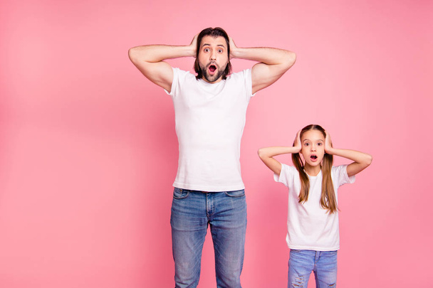 Close up photo beautiful she her little small lady he him his daddy staring on ho expression hold hand arms palms heads wear casual white t-shirts denim jeans isolated pink bright background - Foto, Imagem