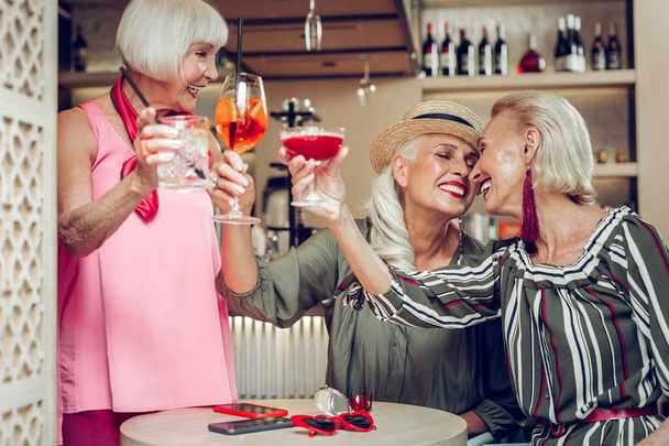 Happy positive aged women enjoying their reunion - Фото, зображення