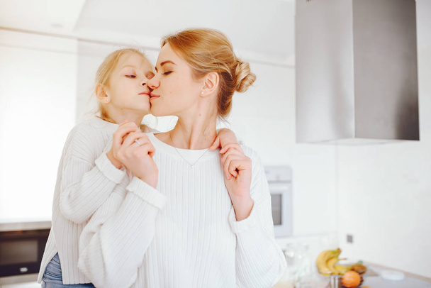 mother with cute blond daughter - Фото, изображение