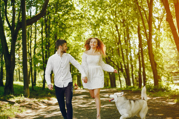elegant couple in a forest - Фото, изображение