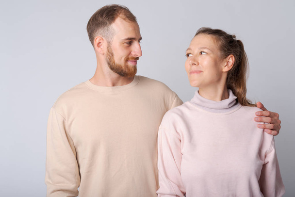 Portrait of young couple looking at each other - Photo, Image