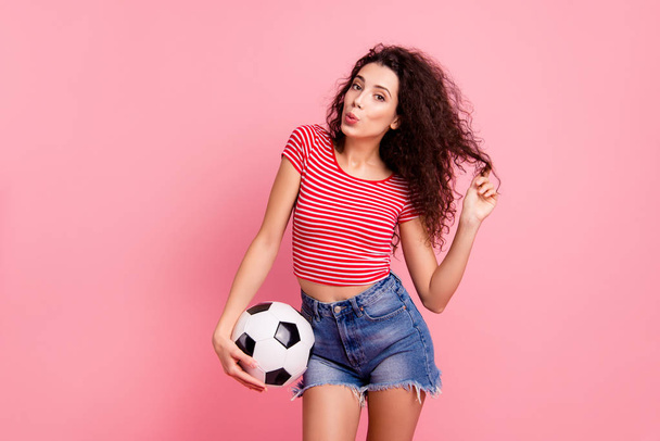 Portrait of her she nice attractive lovely charming cheerful cheery wavy-haired girl holding in hand ball playing with curls sending air kiss isolated over pink pastel background - Fotoğraf, Görsel