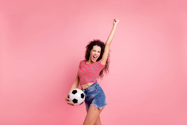Portrait of her she nice attractive lovely charming cheerful cheery ecstatic wavy-haired girl holding in hand ball raising hand up isolated over pink pastel background - Foto, Bild