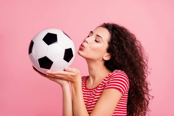 Close-up portrait of her she nice-looking attractive lovely charming sweet tender wavy-haired girl holding in hand on palm ball kissing isolated over pink pastel background - Fotó, kép