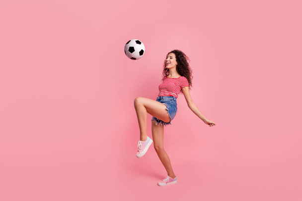 Full length body size view portrait of her she nice-looking attractive lovely cheerful cheery wavy-haired girl playing with ball isolated over pink pastel background - Fotografie, Obrázek