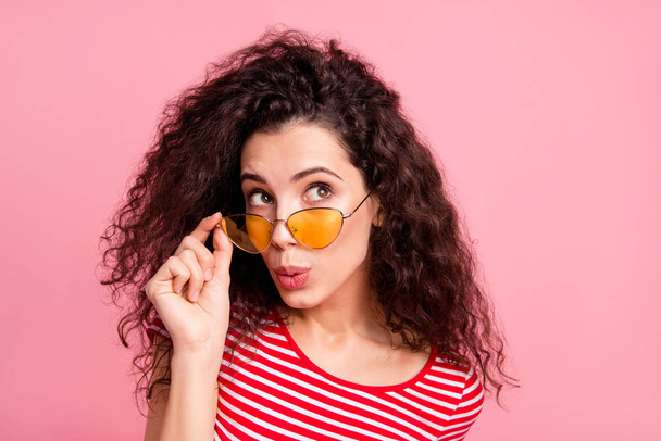 Close-up portrait of her she nice-looking attractive winsome charming lovely cute shine girlish wavy-haired lady putting off glasses looking aside isolated over pink pastel background - Foto, Imagen