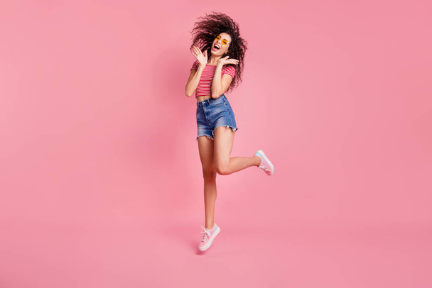 Full length body size view portrait of her she nice-looking attractive charming lovely cheerful cheery glad delighted funny wavy-haired lady having fun isolated over pink pastel background - Foto, immagini