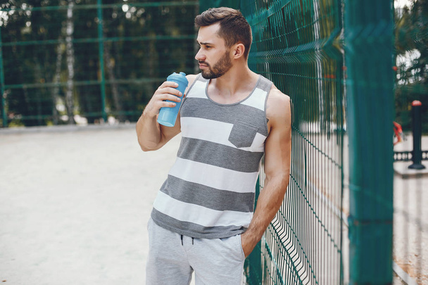 Sports man in a morning summer park  - Fotografie, Obrázek
