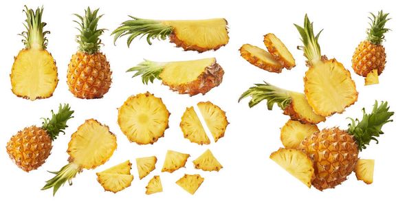 Fresh ripe whole and cut baby Pineapple with slices and leaves  - Photo, Image