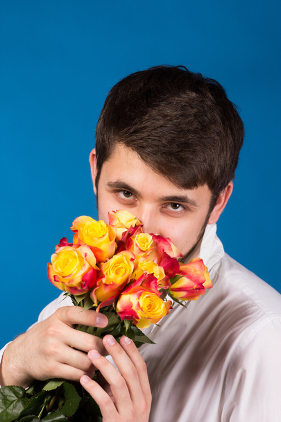 Man with bouquet of red roses - Photo, Image