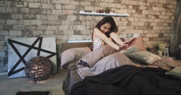Beautiful young woman waking up in the morning very happy with a little hangover , she have a smiling faces , modern bedroom design - Filmagem, Vídeo