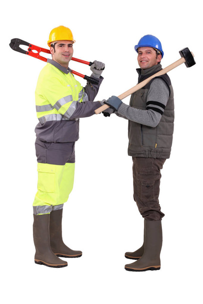 Construction workers shaking hands - 写真・画像
