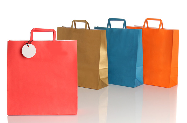 Assorted colored shopping bags over white background - Fotó, kép