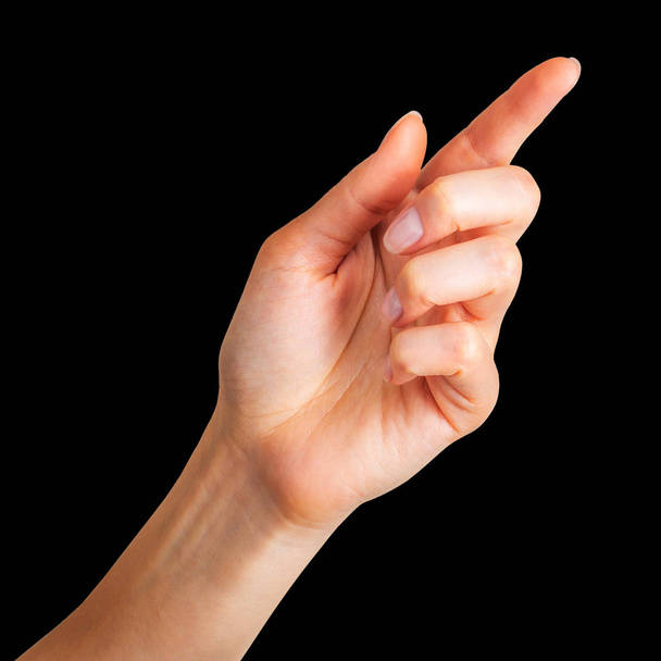 Woman hand with the index finger pointing up - Foto, Bild